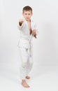 Karate boy in white kimono fighting Royalty Free Stock Photo