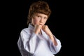 Karate boy in white kimono isolated on black Royalty Free Stock Photo