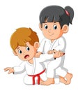 The karate couple are practicing some trick to beat enemy