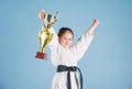 Karate fighter child. Karate sport concept. Self defence skills. Karate gives feeling of confidence. Strong and