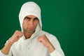 Karate fighter isolated on white emotions of a handsome man guy on a green background chromakey close-up dark hair young Royalty Free Stock Photo