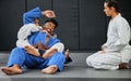 Karate, fitness and martial arts students learning sport, training and discipline from their coach at workout, exercise Royalty Free Stock Photo