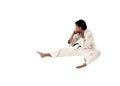 Karate flying kick young male fighter isolated Royalty Free Stock Photo