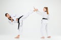 The karate girl and boy with black belts Royalty Free Stock Photo