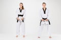 The karate girl and boy with black belts Royalty Free Stock Photo