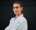 . Karate, judo or taekwondo woman in white kimono for martial arts, jiu jitsu and kung fu against a black studio Royalty Free Stock Photo