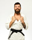 Karate man with angry face in uniform. Jiu Jitsu master