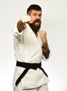 Karate man with angry face in uniform. Man with beard Royalty Free Stock Photo