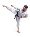 Karate. Man in a kimono hits foot Royalty Free Stock Photo