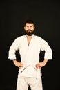 Karate man with strict face in uniform. Jiu Jitsu master