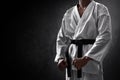 Karate martial arts fighter on dark background Royalty Free Stock Photo