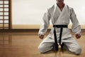 Karate martial arts fighter sitting Royalty Free Stock Photo