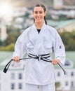 Karate, ready and portrait of a woman training on a rooftop for professional event, competition and fight. Black belt