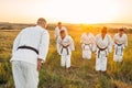 Karate team on training with master in field