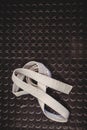 Karate white belt on metallic background