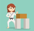 Karate woman getting ready to break the wood