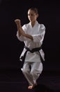 Karateka girl on black background Royalty Free Stock Photo