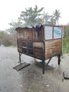 Karawang, Indonesia, 5 October 2022: the chicken coop exposed to the rain, the wind stays strong