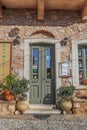 1-06-2018 Kardamyli Greece - Entrance to Apmakeio pharmacy in seaside village in traditional storefront with cobbletones and