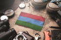 Karelia Flag Between Traveler`s Accessories on Old Vintage Map. Tourist Destination Concept