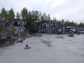 Karelia, ruskeala, Italian quarry, stone mining, stone wall, gray stones, rocks, granite, gray marble, quarry, small trees Royalty Free Stock Photo