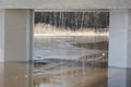 Landscape under the bridge over the river, strict lines of supports and frozen water Royalty Free Stock Photo