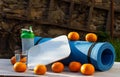 Karemat, tangerines, scales and glass of water on a wooden table Royalty Free Stock Photo