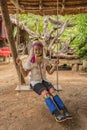 Karen woman from Pai at Mae Hong Son, Thailand playing swing Royalty Free Stock Photo