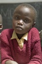 Karimba School with close up of young student in new classroom in North Kenya, Africa