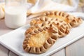 Karjalanpiirakat, Karelian pasties on a rustic table Royalty Free Stock Photo