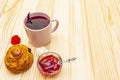 Karkade tea from hibiscus petals Sudanese rose. Gentle romantic breakfast concept. Buns, meringues, strawberry jelly. On a