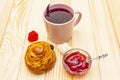 Karkade tea from hibiscus petals Sudanese rose. Gentle romantic breakfast concept. Buns, meringues, strawberry jelly. On a