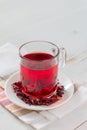 Karkade tea on white wood background Royalty Free Stock Photo