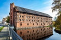 Karlino, Zachodniopomorskie / Poland - October, 15, 2019: Old brick granary on the river. Brick building in Central Europe