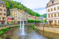 Karlovy Vary, Czech Republic, May 11, 2019: people are walking down street and Tepla river embankment Royalty Free Stock Photo