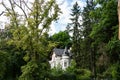 Karlovy Vary, Czech Republic - old villa on the hill covered by beautiful trees in historic Karlovy Vary (Carlsbad)