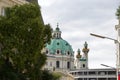 Karlskirche, Vienna, Austria, framed by trees and buildings