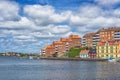KARLSKRONA, SWEDEN - 2017 July. Typical red Swedish wooden houses with natiaonal flag in the city of Karlskrona Royalty Free Stock Photo