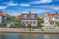 KARLSKRONA, SWEDEN - 2017 July. Typical red Swedish wooden houses with natiaonal flag in the city of Karlskrona Royalty Free Stock Photo