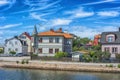 KARLSKRONA, SWEDEN - 2017 July. Typical red Swedish wooden houses with natiaonal flag in the city of Karlskrona Royalty Free Stock Photo