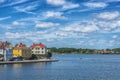 KARLSKRONA, SWEDEN - 2017 July. Typical red Swedish wooden houses with natiaonal flag in the city of Karlskrona Royalty Free Stock Photo