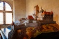 Karlstejn, Czech Republic, 12 March 2022: medieval gothic castle interior, plaster model of castle with towers on hill, grand hall