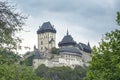 Karlstejn gothic castle with trees frame, Czech Republic