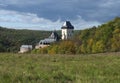 Karlstejn gothic state castle near Prague, the most famous castle in Czech Republic with grass meadow and autumn colored trees and