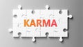 Karma complex like a puzzle - pictured as word Karma on a puzzle pieces to show that Karma can be difficult and needs cooperating
