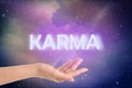 Karma concept. Woman against starry sky in night, closeup of hand