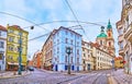 Panorama of Karmelitska Street with old houses and St Nicholas Church, Prague, Czech Republic Royalty Free Stock Photo