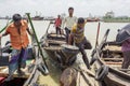 3 mans are lifting on boats in Karnafuli River Sadarghat areas, Chittagong, Bangladesh.