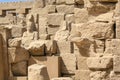 Karnak temple complex in Luxor, Egypt. Ruins of ancient temple with broken staues of pharaos