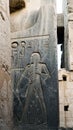 Karnak temple luxor with Egyptian hieroglyphic on granite sculture stone base showing fat man with belly showign abundance in